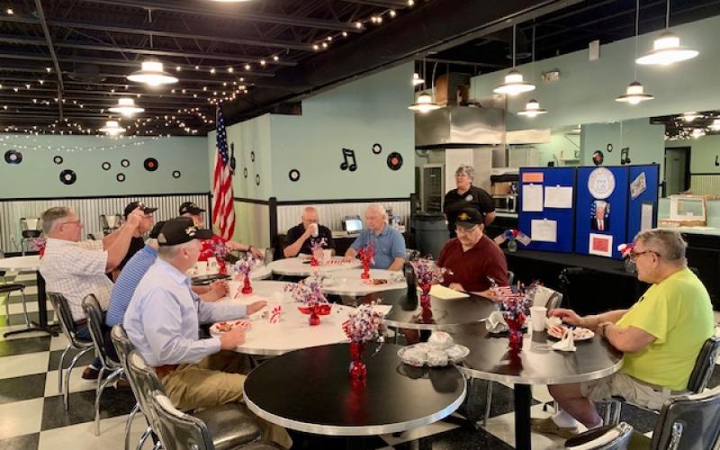 Photo courtesy of the Forward Rabun/ Rabun County Chamber of Commerce. Veterans gather to connect and share a meal during the Vet to Vet Café. The event meets on the second Tuesday of each month and provides resources for local veterans. 