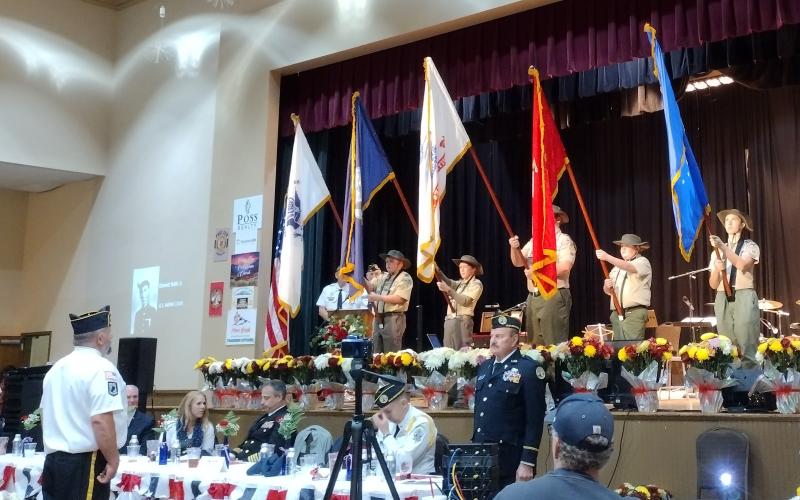 Photo courtesy of Conner Horn. Boy Scout Troops 6 and 19 present the military branch flags while branch anthems for the Army, Marine Corps, Navy, Air Force and Coast Guard play as veterans stand to be honored at the Veterans Appreciation Dinner Nov. 10. 