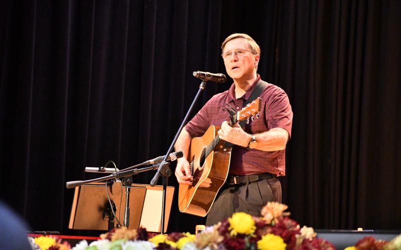 Megan Broome/The Clayton Tribune. Greg Funkhouser sings and performs his original song, “Thank You for Answering the Call,” to thank all of the veterans for their sacrifice and service at the Veterans Appreciation Dinner Nov. 10. 