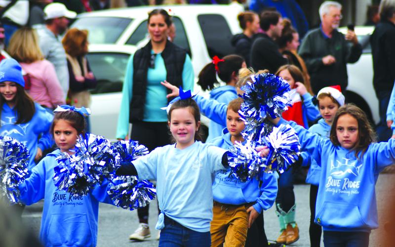 Enoch Autry/The Clayton Tribune. Children from the Blue Ridge Activity & Tumbling Center walk in the Clayton downtown Dec. 3 parade. Shown (from left) are Tori Speed, Juliet Pitassi, Lakin Griffin, Luke Arnett, Lily Rose Tyson and Olivia Briones.