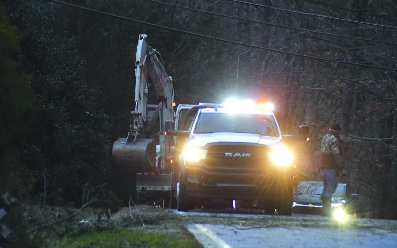 Enoch Autry/The Clayton Tribune. Rabun County crews clean tree limbs off Charlie Mountain Road on Dec. 23. The frigid cold weather last week produced gusting winds.