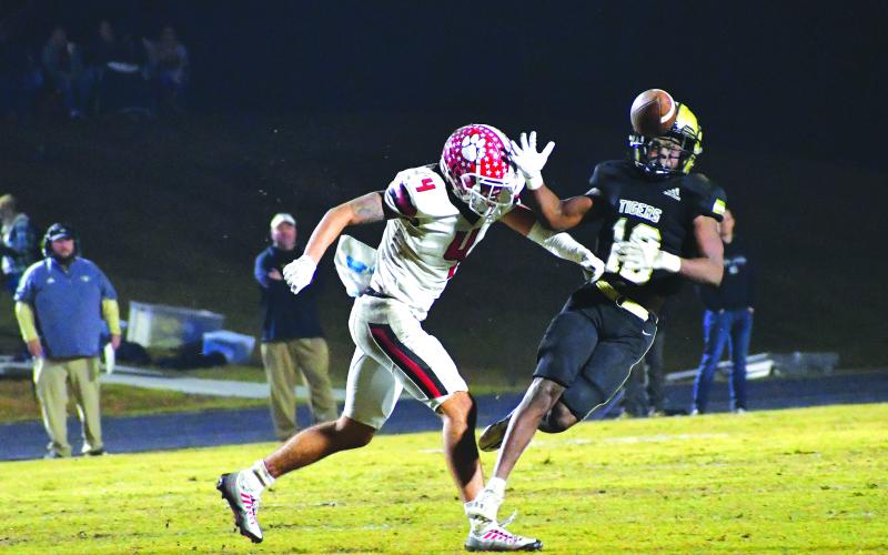 Luke Morey/The Clayton Tribune. RCHS senior Noah Legault forces an incompletion against Swainsboro last Friday night. Legault did not allow a passing touchdown the entire season.