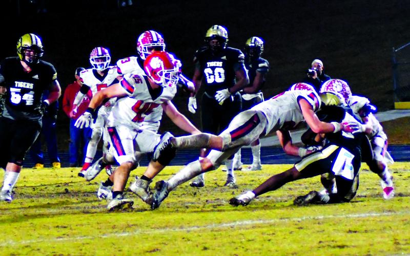 Luke Morey/The Clayton Tribune. Rabun County senior Ethan Owens (45) looks on as junior Paul Picciotti and senior Nic Baloga combine to bring down Swainsboro’s Damello Jones. Baloga ended the season with 196 total tackles, good for 12th in the nation. Owens ended with 113 total tackles in the regular season, good for top 10 in the state. Picciotti led the team with six sacks as well as 54 tackles and 10 for a loss.