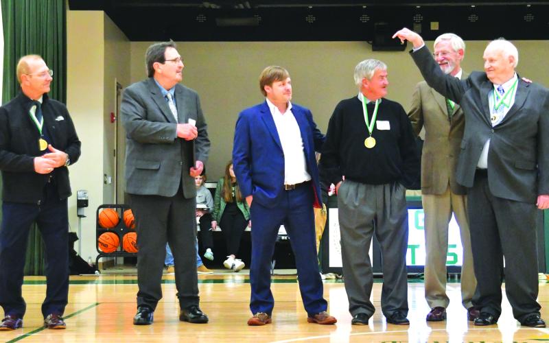 Enoch Autry/The Clayton Tribune.  The 2022 Hall of Honor inductees were honored on Saturday night. From left, Chuck Nunn, the 1968 football team who had four representatives show up, and Tim Crenshaw. 