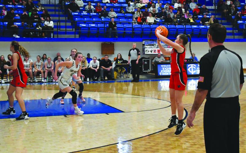 Luke Morey/The Clayton Tribune. Junior Mili Watts hits a three on Wednesday, Dec. 28 against Hayesville. Watts is the defensive engine for the Lady Cats as she posted at least four steals in each of the three tournament games.  