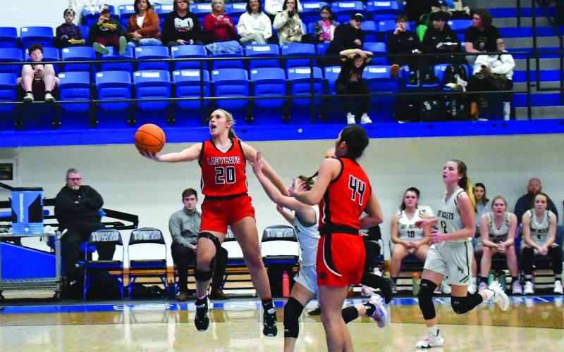 Luke Morey/The Clayton Tribune. RCHS junior Ellie Southards goes in for a basket against Franklin in the tourney final. Southards was named the MVP while Lucy Hood and Mary Lovell made the all-tourney team.
