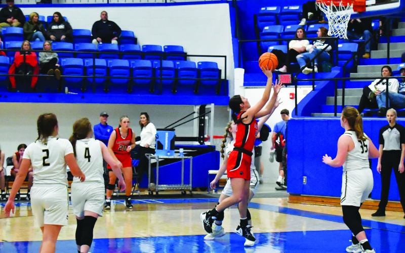Luke Morey/The Clayton Tribune. Senior Mary Lovell spins to hit a basket on Wednesday, Dec. 28 against Hayesville. Lovell was named to the All-Tournament team. 