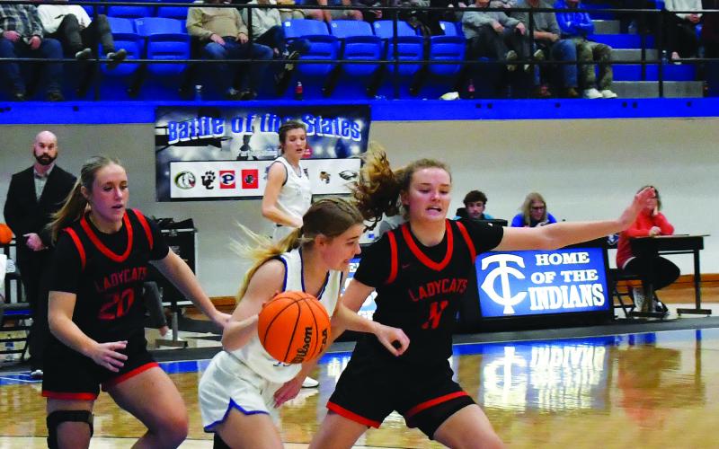Luke Morey/The Clayton Tribune. Juniors Ellie Southards and Lucy Hood combine to put pressure on a Towns County ball handler on Thursday, Dec. 29. Southards averaged nearly 18 points per game on her way to being name Tournament MVP as Hood posted 16 ppg to be named to the All-Tournament team. 