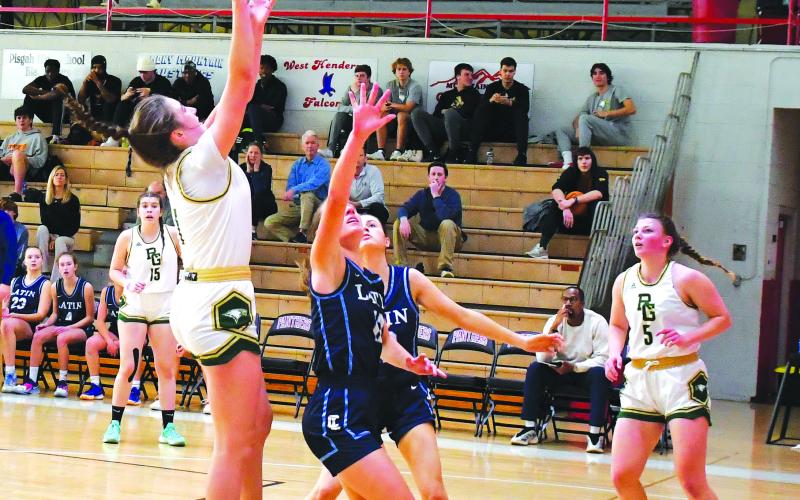 Luke Morey/The Clayton Tribune. RGNS junior Sofia McNabb gets an offensive rebound against Charlotte Latin on Saturday, Feb. 18. Now McNabb and the Lady Eagles play in the state championship game on Saturday, Feb. 25.