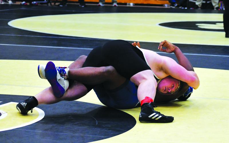 Luke Morey/The Clayton Tribune.  RCHS senior Jet Galbreath pins Jaleel Shellmen from Savannah in the quarterfinals of sectionals. Galbreath also made it to the first-place match and also had a rematch of the Area tournament first place match, against Hoke Poe-Hogan from Commerce. Poe-Hogan again won over Galbreath. Galbreath also heads to state with another chance to place after taking fourth place last year.