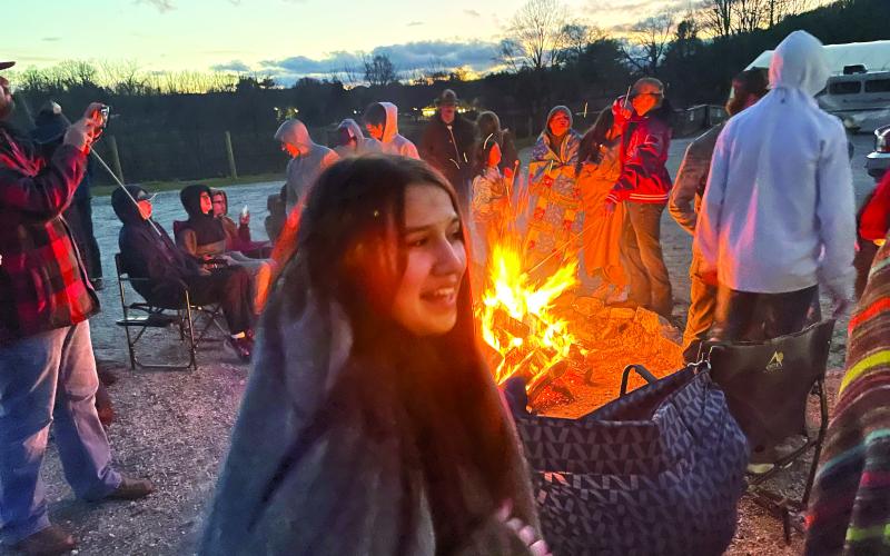 Submitted photo. On a cool evening, the RCHS FFA enjoy the warmth of a bonfire.