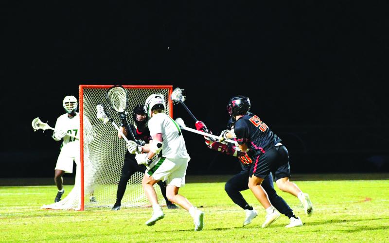 Luke Morey/The Clayton Tribune. Rabun Gap’s Jack Moores weaves through the defense for a goal against North Oconee on Tuesday, March 21. Moores has helped lead the Eagles to a 5-1 start, both playing on offense and defense. 