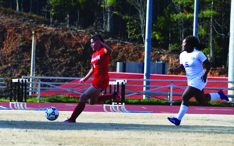 Luke Morey/The Clayton Tribune. Rabun County freshman Zara Apointe scores against Barrow Arts and Science Academy on Friday, March 24. Apointe has 15 goals in 12 games for the Lady Cats. After falling to Tallulah Falls, the Lady Cats next take on Commerce in the final game of the regular season. 