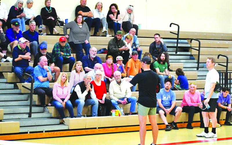 Luke Morey/The Clayton Tribune. Pickleball pro Mark Price speaks to the crowd about certain techniques and strategies he employs while fellow pro David Spearman, in blue, looks on. After the pickleball exhibition on Sunday, Price led a three-day pickleball camp from March 6-8 with 16 attendees at the Rabun County Recreation Department.