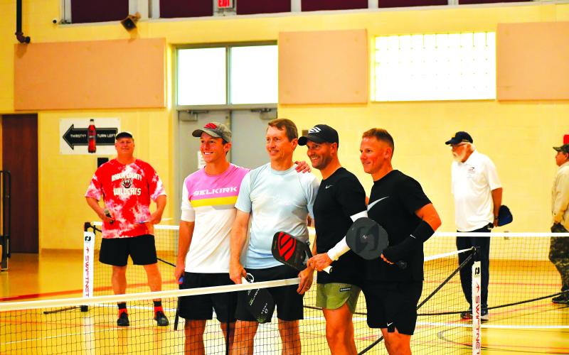 Luke Morey/The Clayton Tribune. The Rabun County Recreation Department hosted the first professional pickleball exhibition in North Georgia, with professionals playing singles and doubles matches on Sunday, March 5. Pictured from left in the foreground are Shea Underwood, David Spearman, Mark Price and David Hebert. After the event, Price led a three-day pickleball camp.