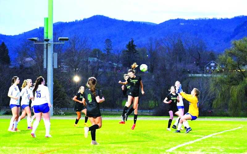 Luke Morey/The Clayton Tribune. Rabun Gap Lady Eagle junior Georgia Mattis heads the ball past the Highlands goalkeeper for the first goal of the night on Wednesday, March 8. Mattis has helped lead the Lady Eagles to a 4-0-1 start by scoring four goals in five games. 