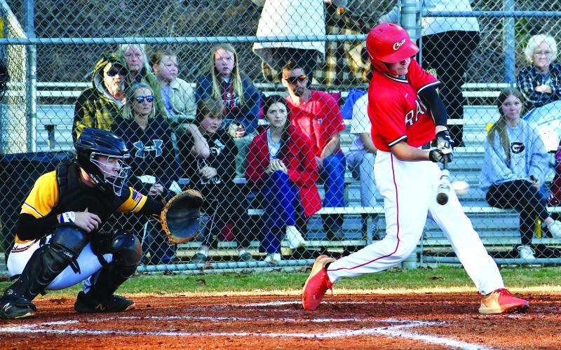Luke Morey/The Clayton Tribune. Rabun County’s Reid Giles earns a base hit against Athens Christian.