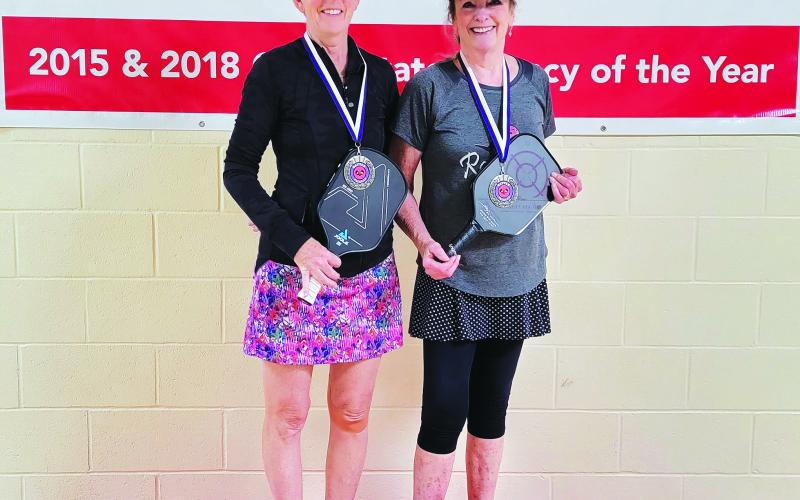 Photography by Tribune staff and Rabun County Recreation Department staff. Amy Buck (left) and Kathy Fincher took the gold medal at the 3.5 skill level in the 50’s age bracket at the annual Battle of the Paddles. 