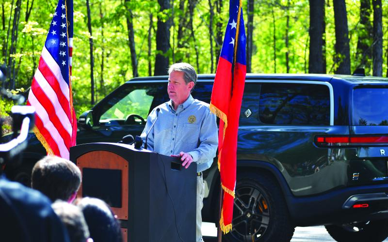 Luke Morey/The Clayton Tribune. Gov. Brian Kemp speaks at Tallulah Gorge State Park about a program that adds electric vehicle chargers Thursday, April 20.