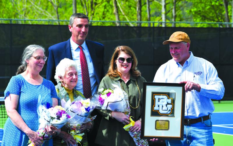 Luke Morey/The Clayton Tribune. From left, Ruth Arbitter Ebbs, Kathleen Arbitter, RGNS Head of School Jeff Miles, Jennifer Arbitter and Stephen Arbitter. During the re-dedication of Donald Arbitter tennis courts, the Arbitter family was honored with a Rabun Gap plaque in memory of Don Arbitter.
