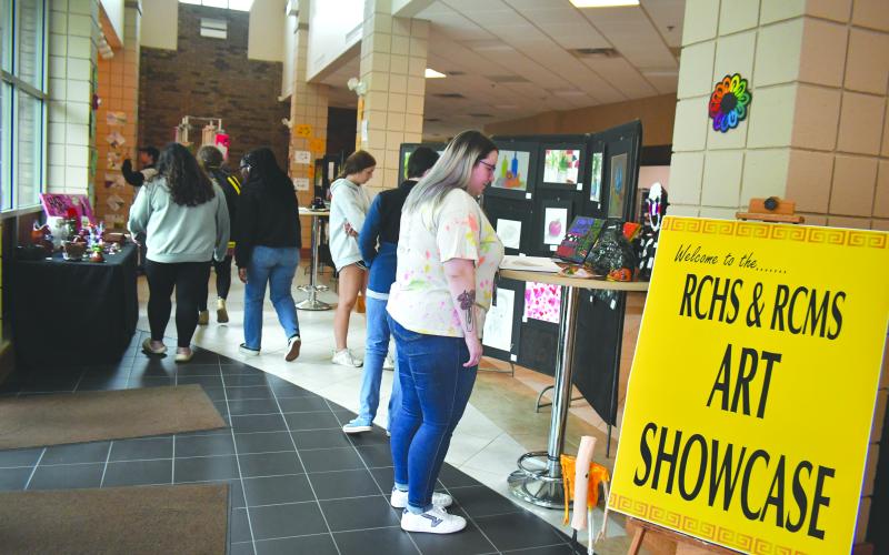 Megan Broome/The Clayton Tribune. Students at Rabun County Schools enjoy viewing the end-of-the-year RCMS/RCHS Art Showcase in the Fine Arts Building (FAB) Friday, May 12. 