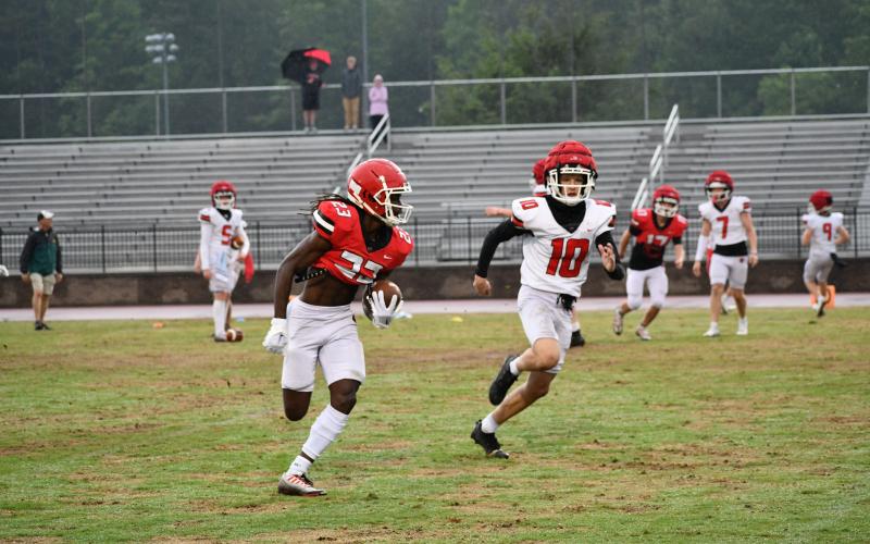 Luke Morey/The Clayton Tribune. Rabun County rising senior Willie Goodwyn gets to the sideline against Clay Blalock during the Spring Game on Thursday, May 18. Goodwyn looks to be the No. 1 wide receiver for the Wildcats after a year where he averaged nearly 23 yards per reception. 