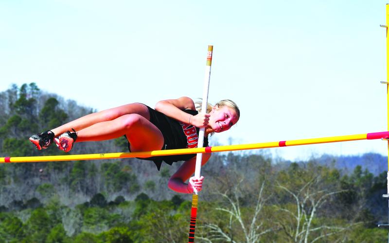 File photo/Luke Morey/The Clayton Tribune. At the Rabun County-hosted Bo James Invitational track meet in March, senior Lady Cat Molly Jo Wright clears the mark in the pole vault. Wright set a personal record of 9 feet at the GHSA state sectional to advance to the state championship in the event.