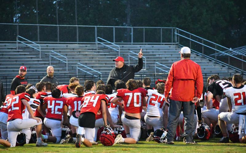 Luke Morey/The Clayton Tribune. Head coach Michael Davis stresses a point at the conclusion of Spring ball to his 2023 Wildcat football team.