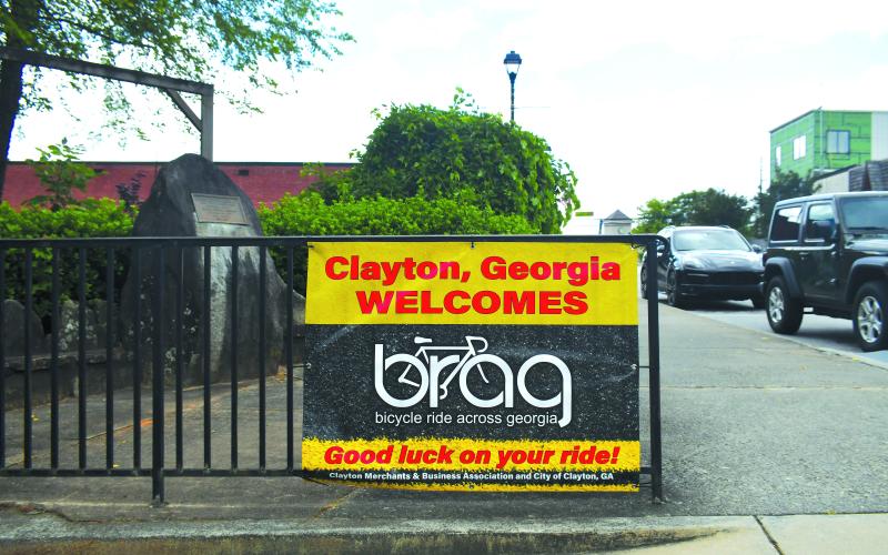 Luke Morey/The Clayton Tribune. A sign welcoming the riders for Bicycle Ride Across Georgia is located along Main Street in Clayton. The City of Clayton will host the BRAG riders as the ride begins on Sunday, June 4. This will be the first time Clayton has hosted the first night of the BRAG, and the first time BRAG has come to Rabun County since 2012 when the ride ended at Rabun County High School in Tiger, Ga.