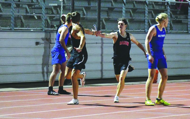 Luke Morey/The Clayton Tribune. In a meet earlier in the season, Hayden Deslich hands off the baton to Rabun County High School 4X400-meter relay teammate Paul Picciotti. The team of Deslich, Picciotti, Hayden Smith and Willie Goodwyn raced to a 3:34.10 in the state Class 1A Division I sectional to set a season record as the Wildcats placed third.