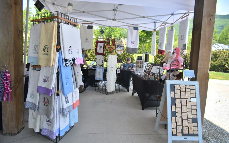 Megan Broome/The Clayton Tribune. Too Cute 2 Cook Embroidery Designs was featured at the Of These Mountains Spring MarketPlace in Clayton Saturday, May 13. 