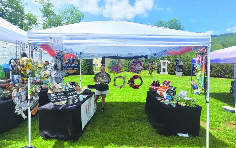 Megan Broome/The Clayton Tribune.  Artist Cynthia Cox from Easley, S.C. with CC’s Intuitive Creations makes wreaths and showcases her artwork at the Sassafras Artisan Market in Clayton April 29-30. 