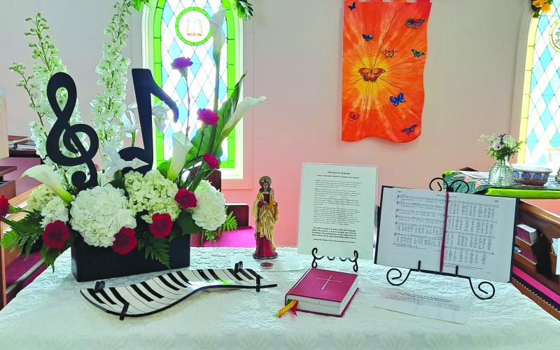 Megan Broome/The Clayton Tribune. This display depicting the theme “The Beauty of Music” was created by parishioners at St. James Episcopal Church for the 15th annual Flower and Liturgical Festival on June 23 and June 24.