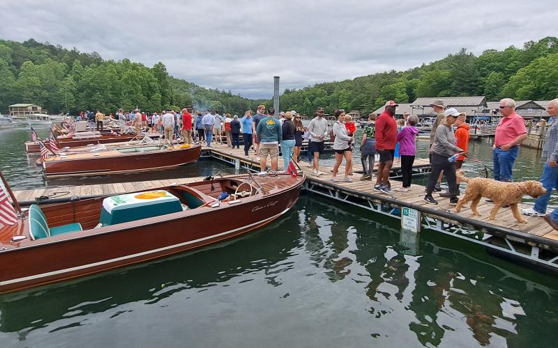 Megan Broome/The Clayton Tribune. Hundreds of people show out to LaPrade's Marina at Lake Burton to view wooden boats on display following the annual Memorial Day parade.