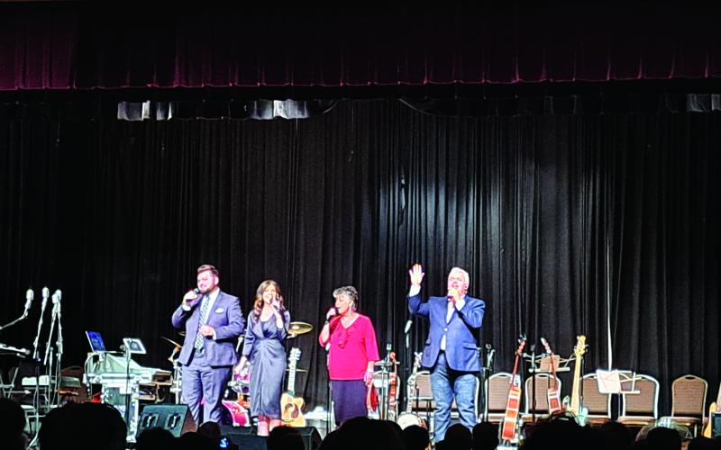 Megan Broome/The Clayton Tribune. Singing family sensation Endless Highway performs during the concert. 