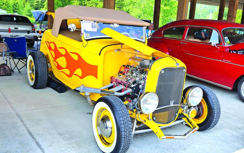 Megan Broome/The Clayton Tribune. This Hot Rod Classic 1932 Ford Roadster with a 350 Engine owned by Brad Millican was featured at the Rumble in Rabun car and bike show. Left: Show judge Jason Whitmire talks with Bruce Martin from Rabun Gap about his Wood Doodlebug Chevette. 