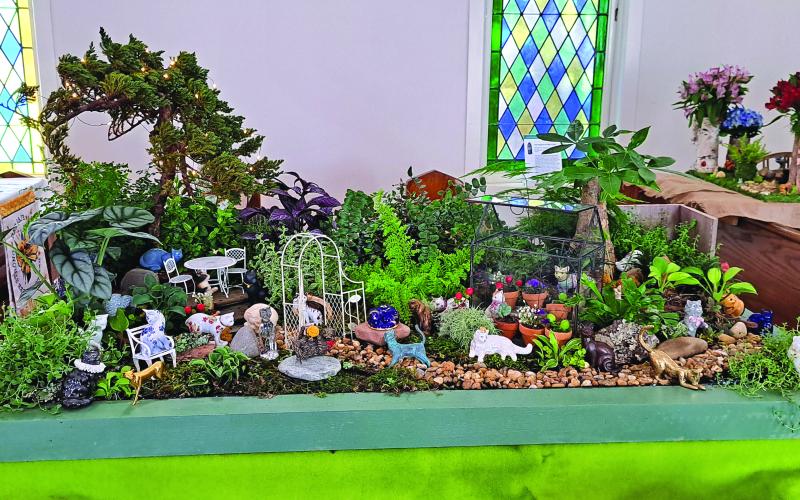 Megan Broome/The Clayton Tribune. The beautiful display depicting “Cats in the Garden” was featured during the Flower and Liturgical Festival last Friday and Saturday. 