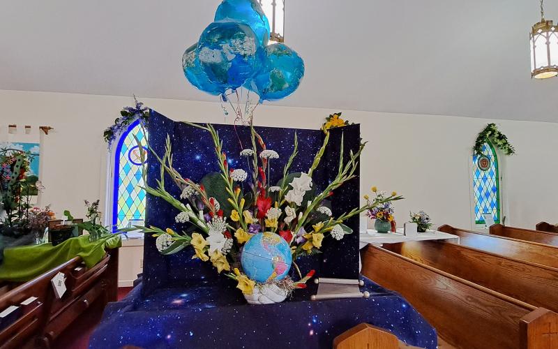 Megan Broome/The Clayton Tribune. A floral arrangement detailing "Plant Earth" was featured at the Flower and Liturgical Festival.