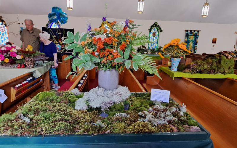 Megan Broome/The Clayton Tribune. This colorful floral arrangement features mosses and lichens. 