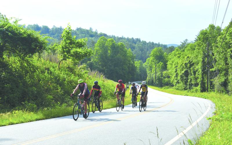 Enoch Autry/The Clayton Tribune. Thousand bicyclists enjoyed the scenery and landscape of Rabun County as Bike Ride Across Georgia, or BRAG, rolled in June 4. Here a group of cyclists pedal on Bridge Creek Road on that Sunday morning.
