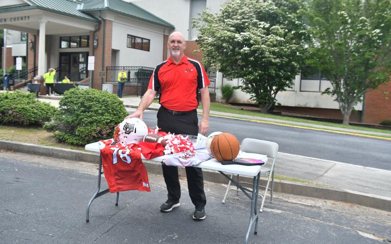 Megan Broome/The Clayton Tribune. Roy Quilliams holds registration for upcoming sports and talks to fifth graders about what the Rabun County Recreation Department does.