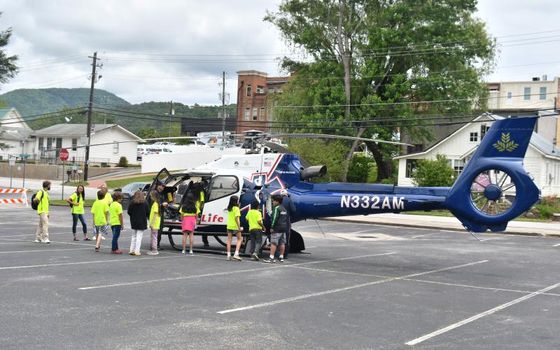 Megan Broome/The Clayton Tribune. Air Life personnel talk to students about what they do and allow them to see the inside of the helicopter first-hand.