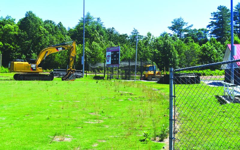 Luke Morey/The Clayton Tribune. Construction equipment has been parked out by the baseball field, with gravel being delivered for the project to begin soon. The baseball field will be finished  in two months once the football field is completed. 