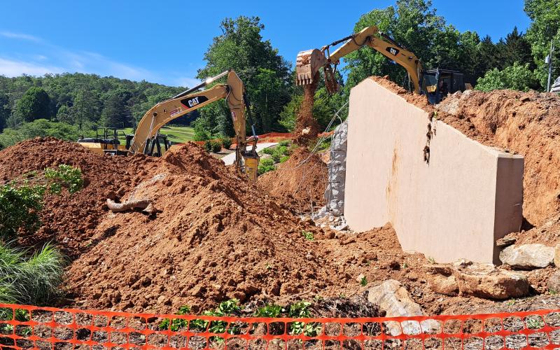 Tom Adams Construction, of Rabun Gap, works to demolish the Rabun County Golf Club building. Demolition is underway after the strength of the building was compromised following a Dec. 23, 2021, structure fire. The building will be built back similarly with the golf carts relocated to the maintenance shed. 