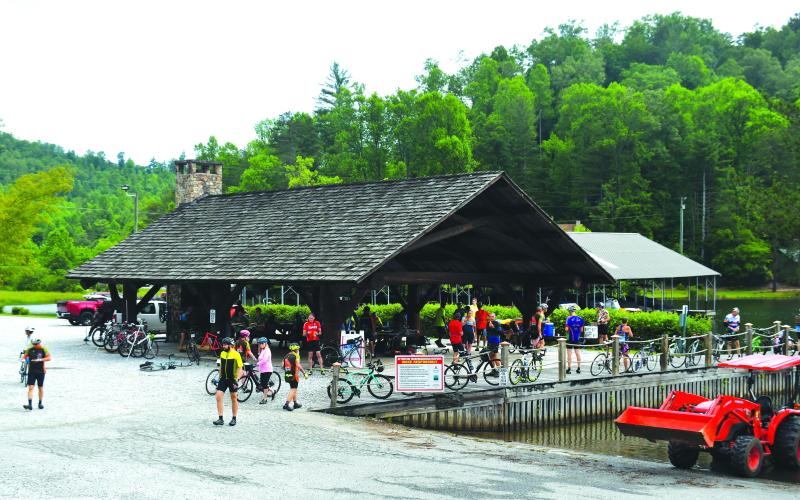 Luke Morey/The Clayton Tribune. Riders reached their second rest stop around 10 a.m. on Sunday, June 4. Cyclists caught their breath, got some snacks and took in the lakefront view at LaPrade’s Marina.
