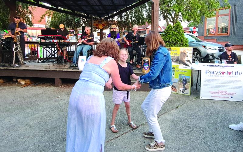 Megan Broome/The Clayton Tribune. Sweet Charity performs at Universal Joint June 3 for a fundraiser event as restaurant-goers have a good time dancing. 