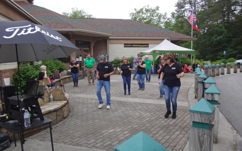 Submitted photo. Dancin’ Darlins line dance class, led by Debbie McClain (foreground, right), performs at the park visitors center. McClain teaches line and square dancing at Your Time Fitness.