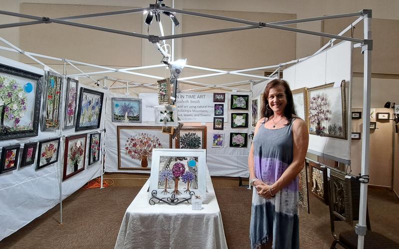 Megan Broome/The Clayton Tribune. Elizabeth Smith uses natural treasures, such as leaves, flowers and wood, from the North Georgia Mountains to create “Frozen In Time Art.” 