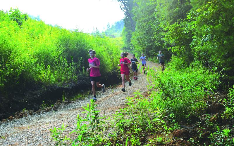 Enoch Autry/The Clayton Tribune. Crayton Smith from RCHS takes on the winding route during the July 18 practice on the Rabun County School System’s property.