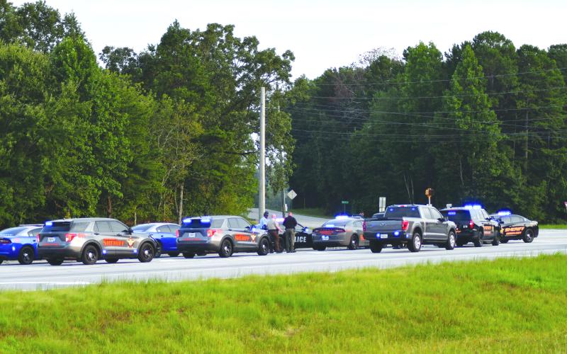 Enoch Autry/The Clayton Tribune. Patrol cars from multiple law enforcement agencies line U.S. 441 in Habersham County where a Louisiana man was taken into custody after a multi-county chase that started in Rabun on Aug. 21.